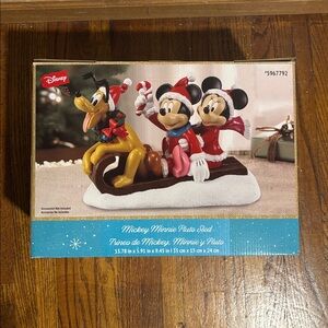 NIB/NWT Disney Festive Mickey and Minnie with Pluto sled figurine.